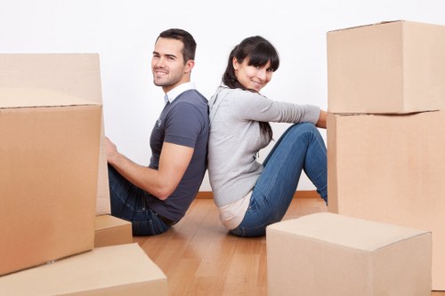 Moving team transporting office furniture in Hackneywick